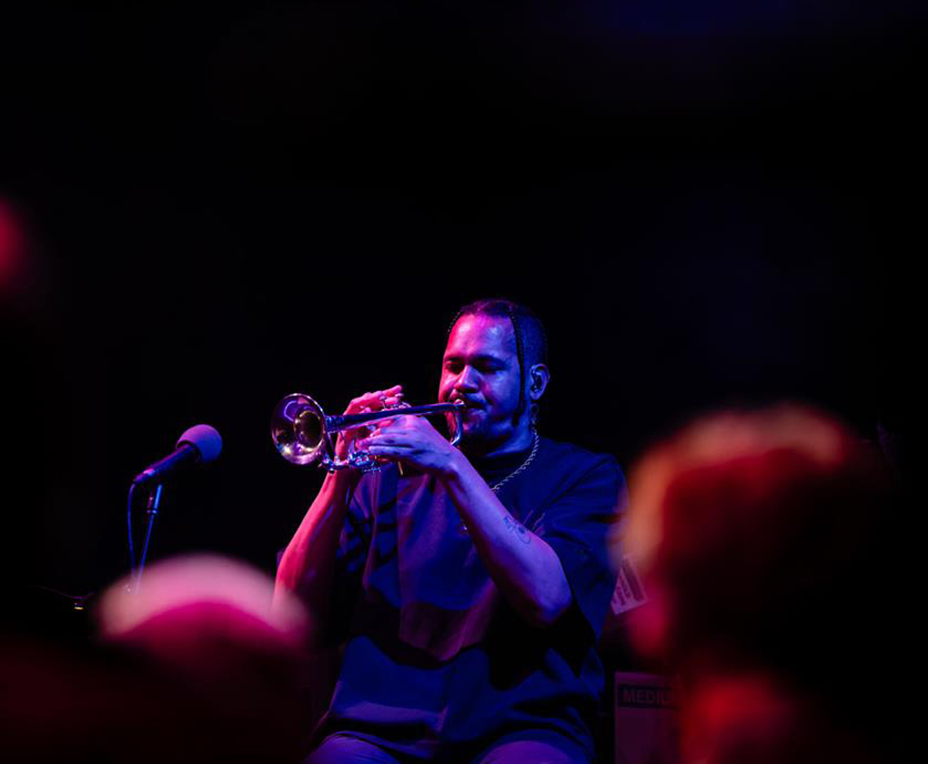 Ahamefule J. Oluo. Trumpet in hand